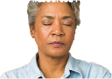 A woman meditating with her eyes closed